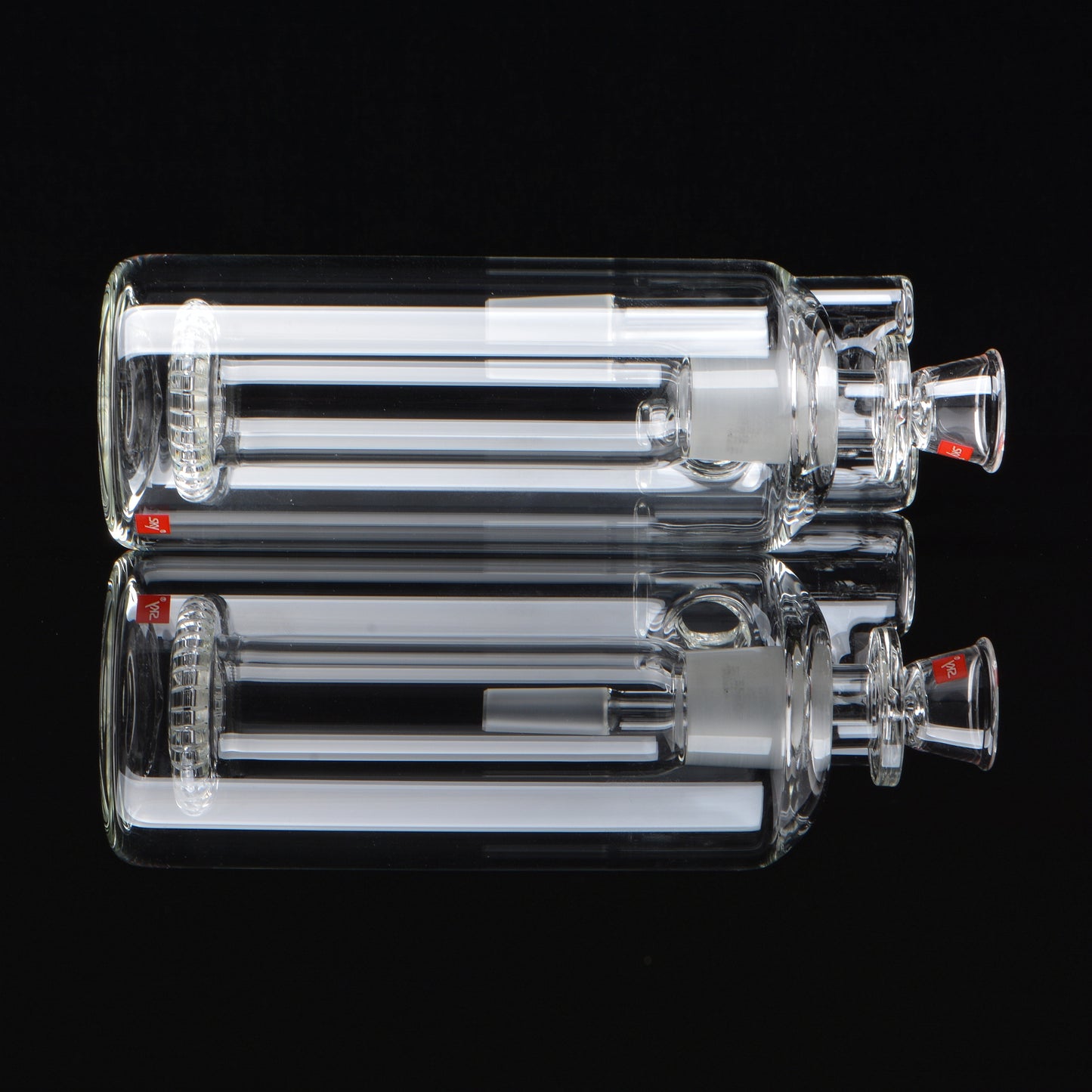 90 degree showerhead ash catcher for a bong laying on its side on a black background