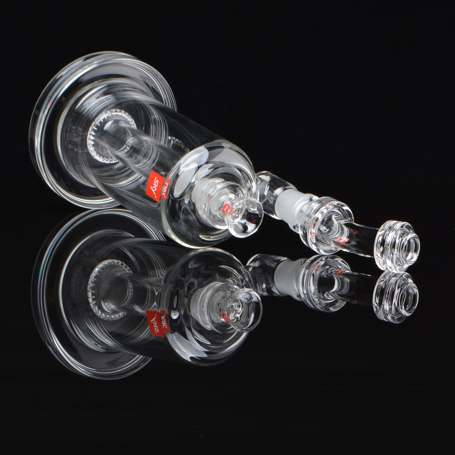 18mm Shower head Bubbler, with a removable mouthpiece, laying on its side, rotated 45 degrees